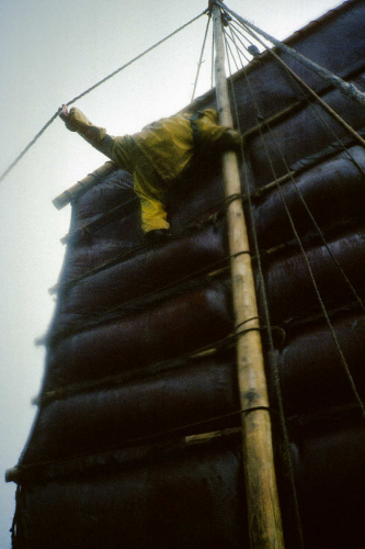 Loi mending sail in gale in Taiwan Strait