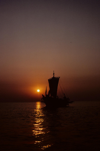Argo against sunset becalmed